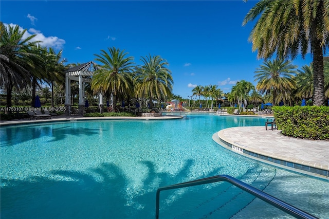 pool featuring a patio area and a pergola