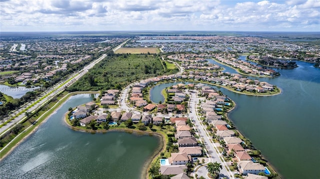 bird's eye view with a water view and a residential view