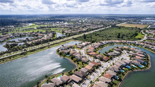 bird's eye view featuring a water view and a residential view