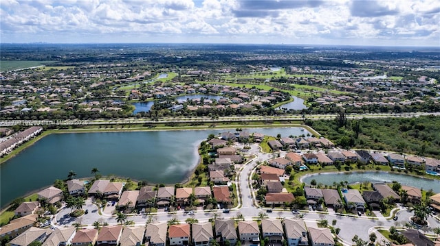 birds eye view of property with a water view and a residential view