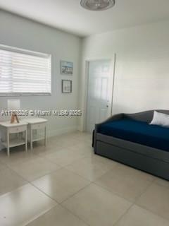 bedroom featuring tile patterned floors