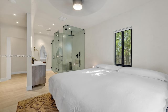 bedroom featuring recessed lighting, visible vents, light wood-style flooring, and baseboards