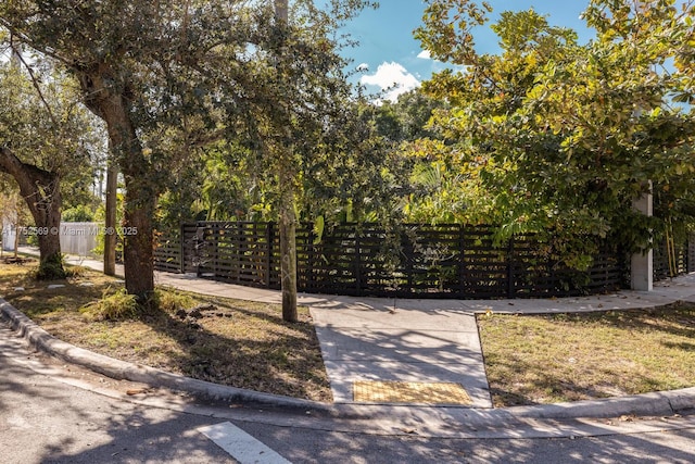 view of gate with fence