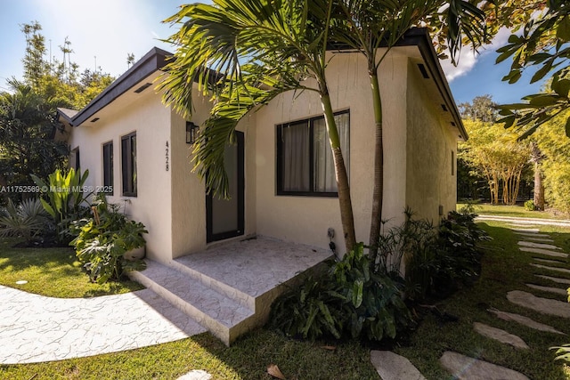 view of property exterior with stucco siding