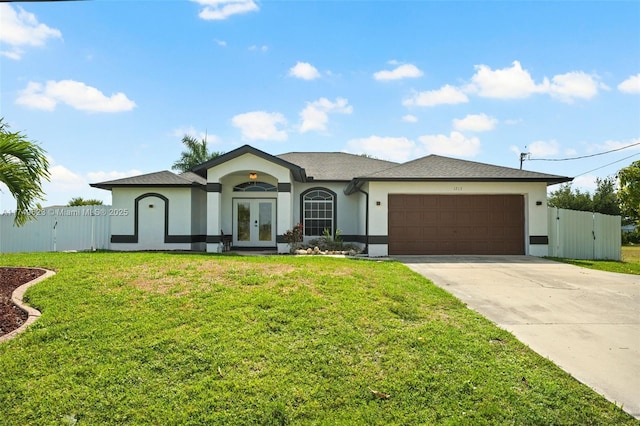 view of front of property with french doors, stucco siding, concrete driveway, fence, and a front lawn