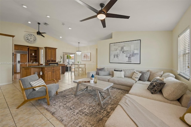 living area with visible vents, lofted ceiling, ceiling fan, light tile patterned flooring, and recessed lighting