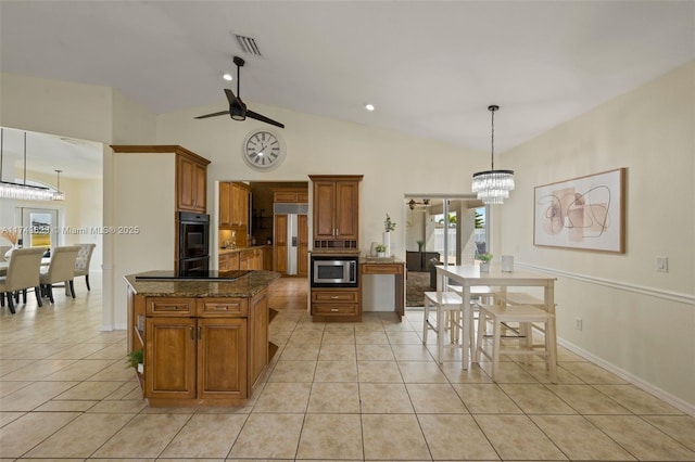 kitchen with brown cabinets, visible vents, black appliances, and light tile patterned flooring