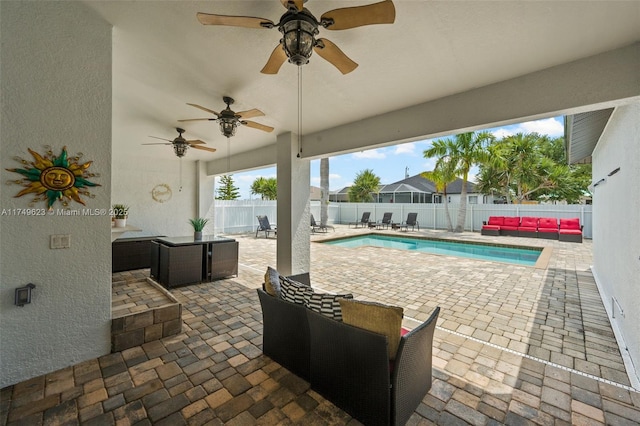 view of patio with a fenced backyard, outdoor lounge area, and a fenced in pool