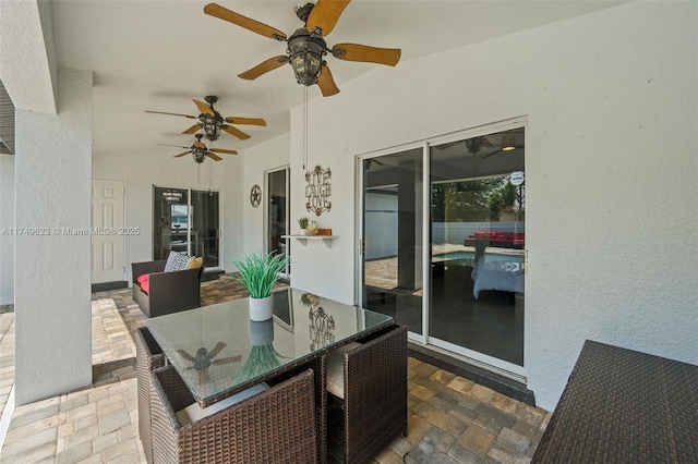 view of patio / terrace featuring outdoor dining space and a ceiling fan