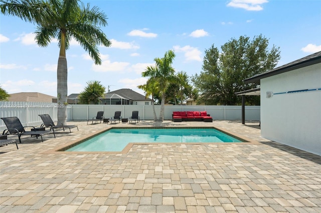 view of swimming pool featuring a fenced backyard, a fenced in pool, and a patio