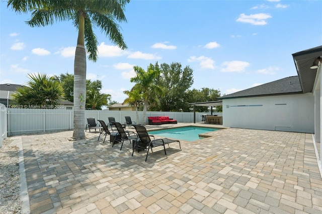 view of pool with a fenced in pool, a patio area, and a fenced backyard