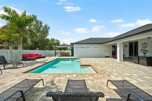 view of pool featuring a fenced backyard, outdoor lounge area, a fenced in pool, and a patio