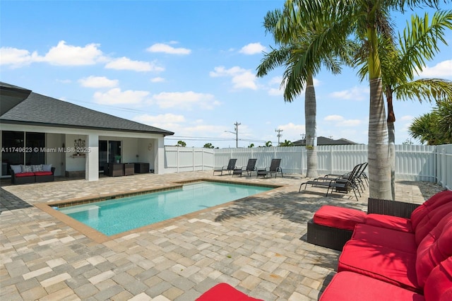 view of pool with a patio, a fenced backyard, an outdoor living space, and a fenced in pool