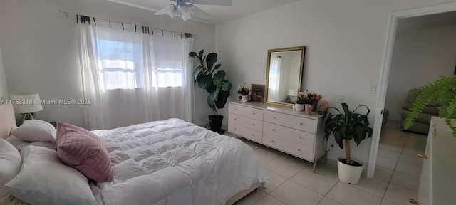 bedroom with light tile patterned floors and ceiling fan