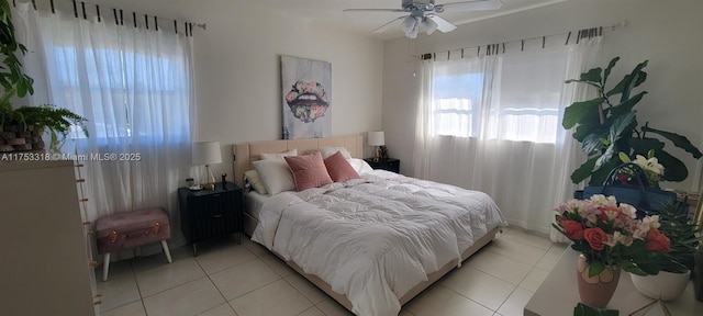 bedroom featuring light tile patterned floors and ceiling fan