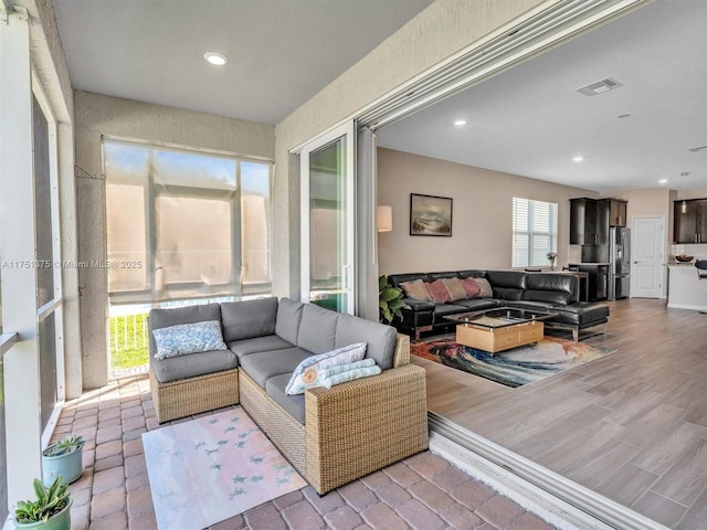 sunroom / solarium featuring visible vents