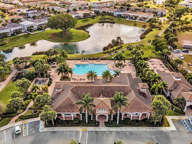 birds eye view of property featuring a water view and a residential view