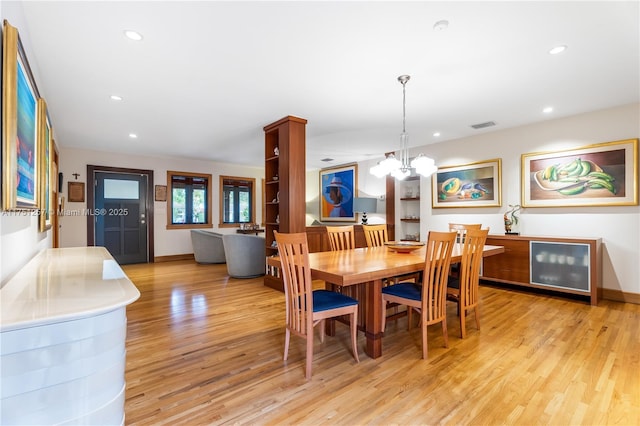 dining room with wine cooler, recessed lighting, visible vents, light wood-style floors, and baseboards