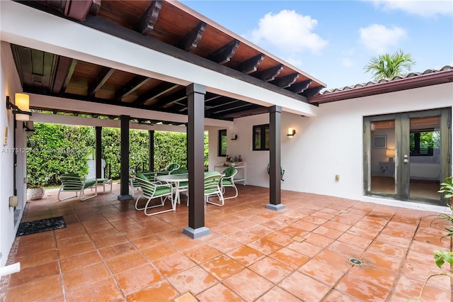 view of patio with french doors and outdoor dining space