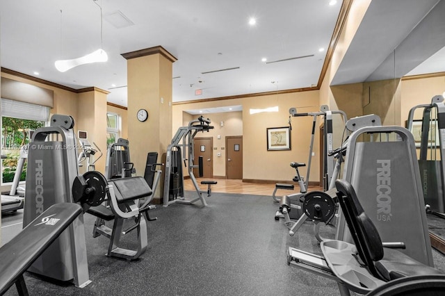 workout area with baseboards, crown molding, and recessed lighting