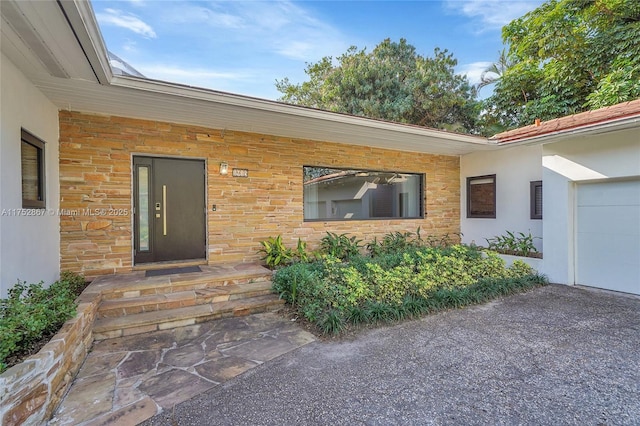1915 S Miami Ave, Miami, FL 33129 - doorway to property featuring an attached garage