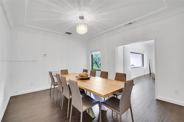 dining room with a wealth of natural light, visible vents, and crown molding