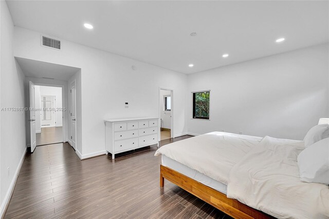 bedroom featuring recessed lighting, visible vents, baseboards, and wood finished floors