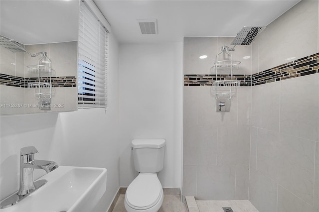 1915 S Miami Ave, Miami, FL 33129 - bathroom with a sink, tiled shower, toilet, and baseboards