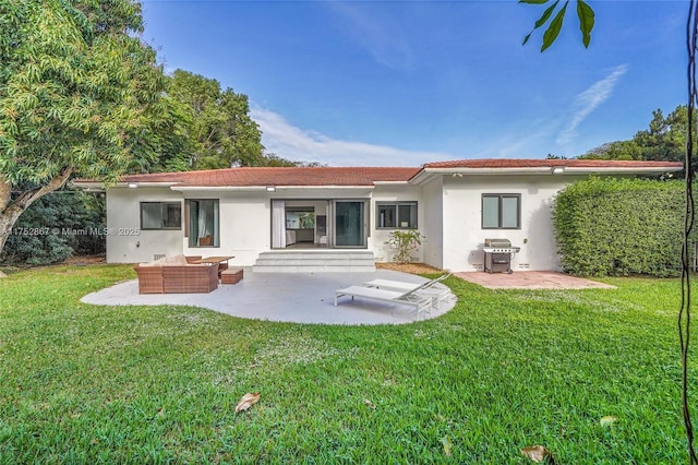 back of house featuring an outdoor hangout area, a yard, a patio area, and stucco siding