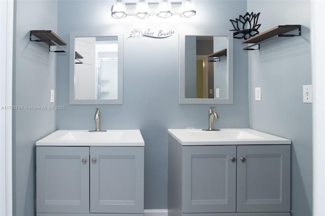 full bathroom with two vanities and a sink