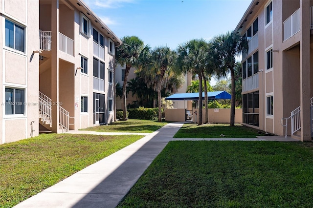 view of home's community featuring a yard