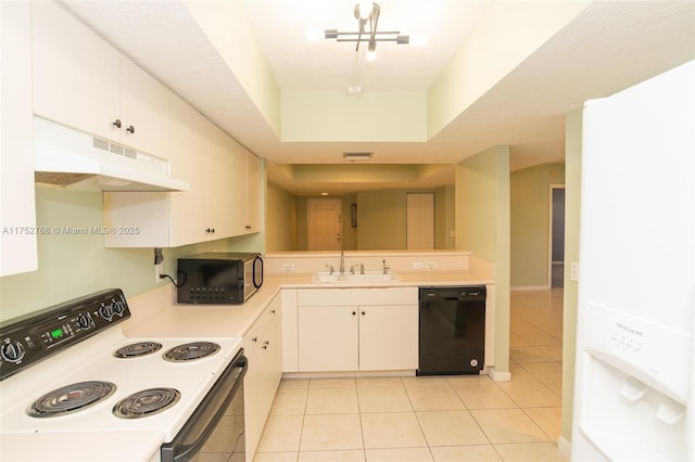 kitchen featuring light tile patterned floors, light countertops, a sink, under cabinet range hood, and black appliances