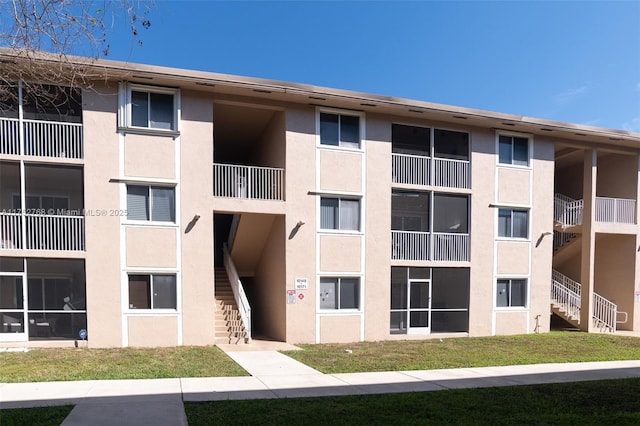 view of building exterior with stairs