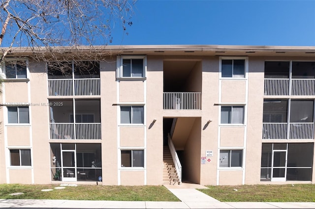 view of property featuring stairs