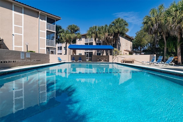 community pool featuring fence