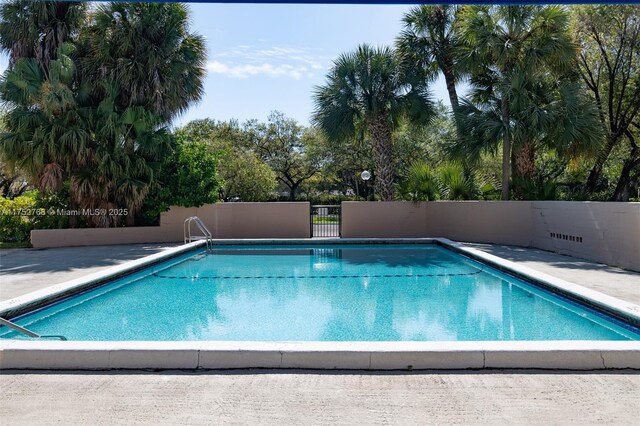 community pool featuring fence