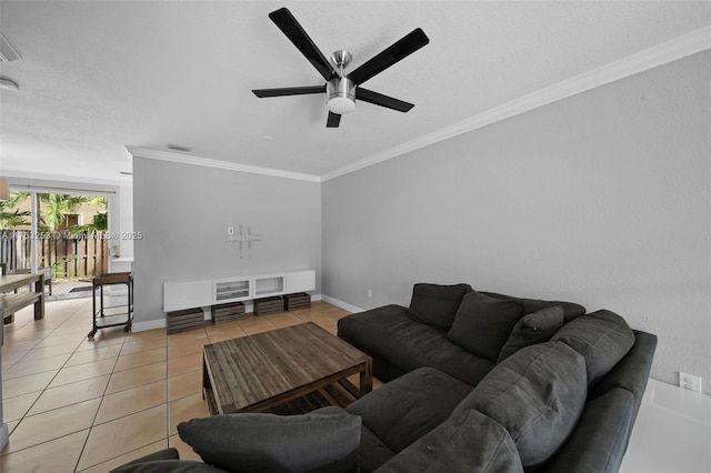 living room featuring ornamental molding, visible vents, baseboards, and light tile patterned floors