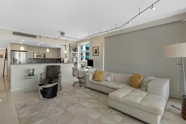 living room featuring rail lighting, visible vents, and light tile patterned floors