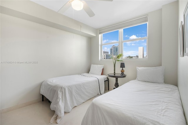 bedroom featuring a ceiling fan and baseboards