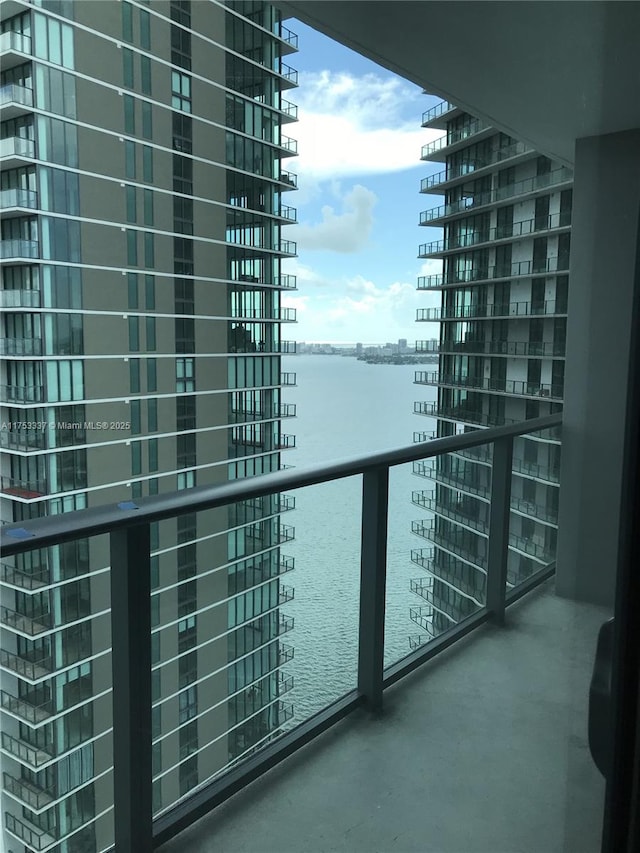 balcony featuring a water view