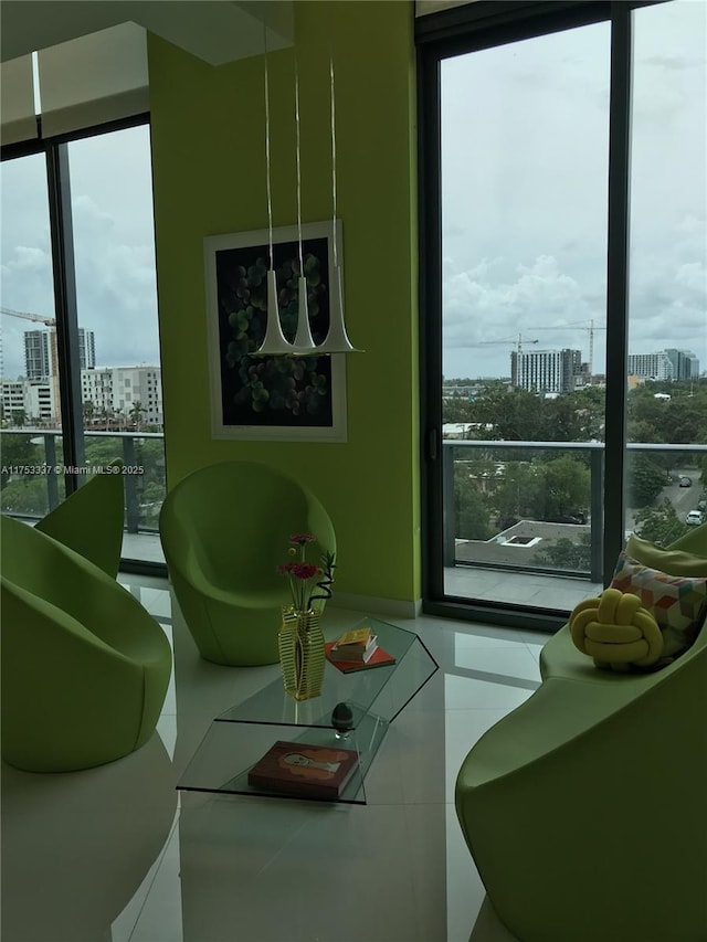 interior space featuring a city view and floor to ceiling windows