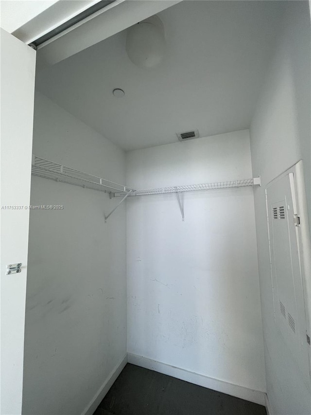 walk in closet with visible vents