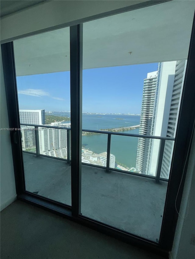 balcony featuring a water view