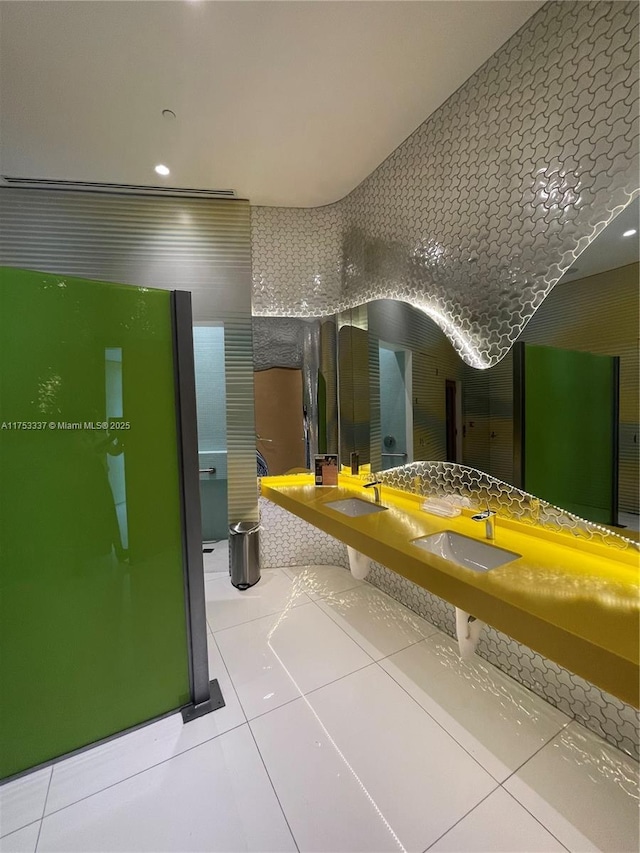 bathroom featuring a sink and tile patterned flooring
