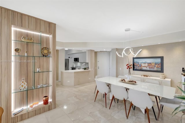 dining area with marble finish floor