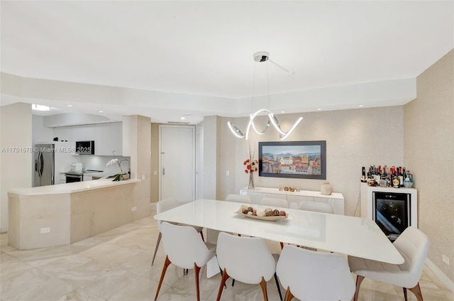 dining area featuring recessed lighting and marble finish floor