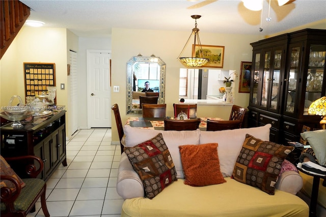 interior space featuring a ceiling fan and light tile patterned flooring