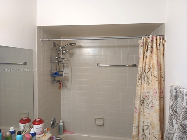 bathroom with shower / bath combination with curtain