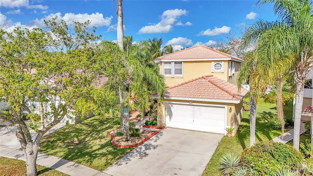 mediterranean / spanish home featuring driveway, a tile roof, a front yard, and stucco siding