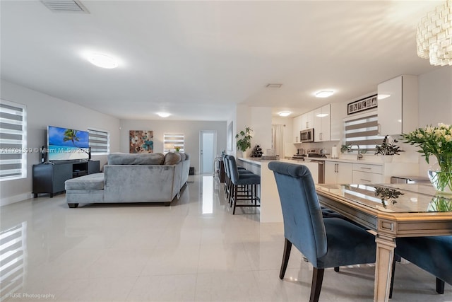 dining area with baseboards and visible vents